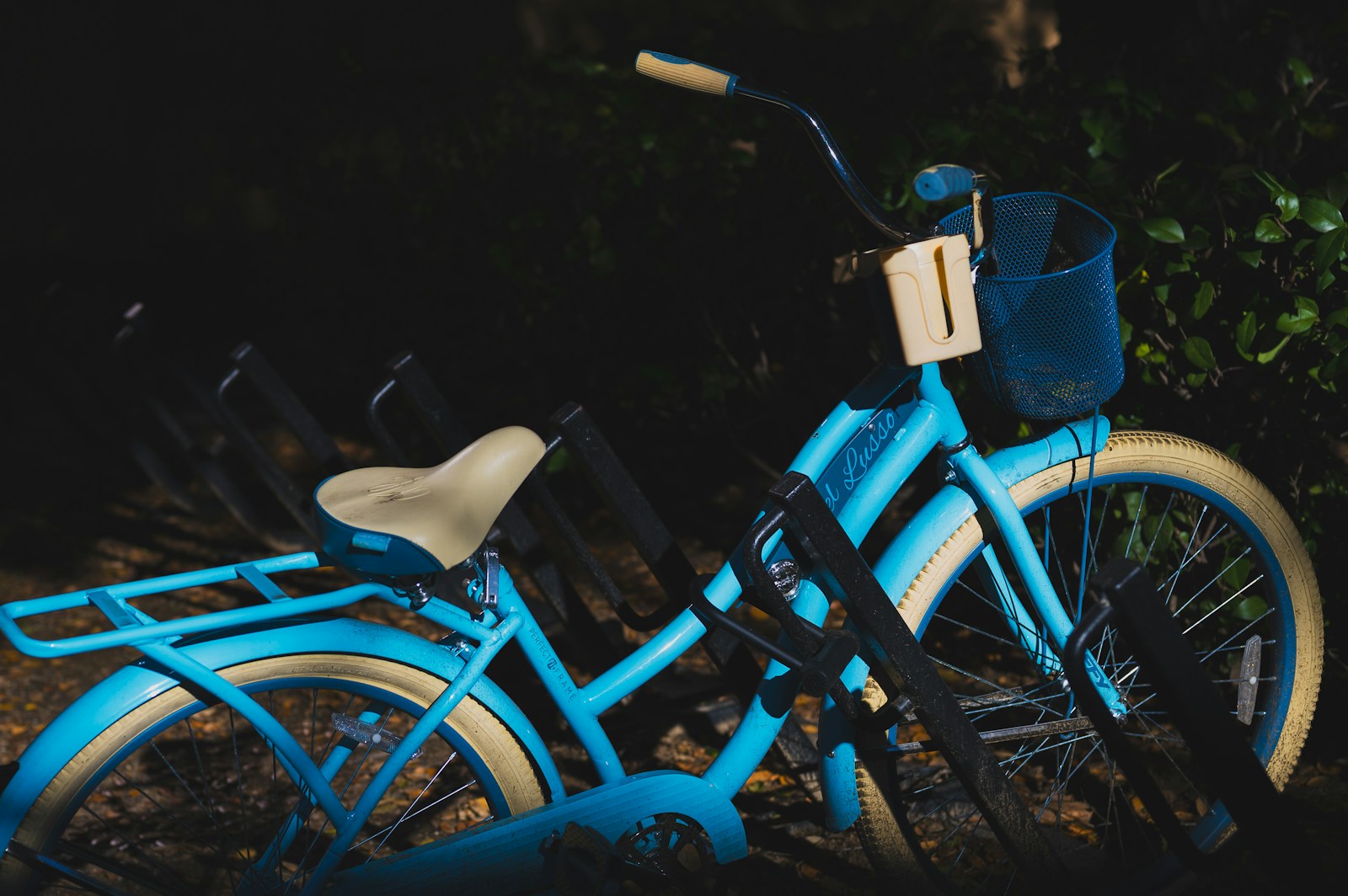 a close up of a blue bike with a basket